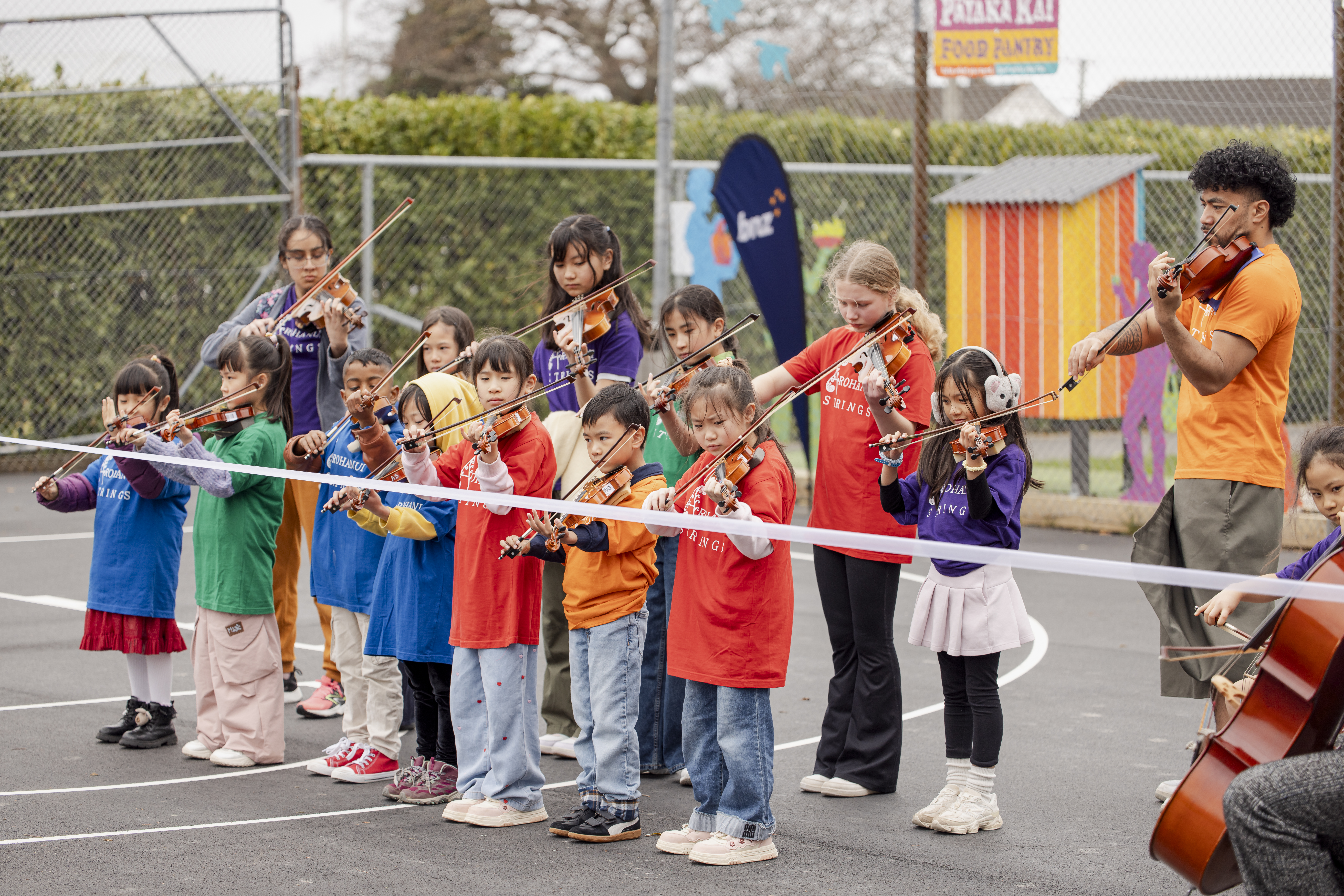 Arohanui Strings+ musicians at BNZ Hoops in Parks at Walter Nash